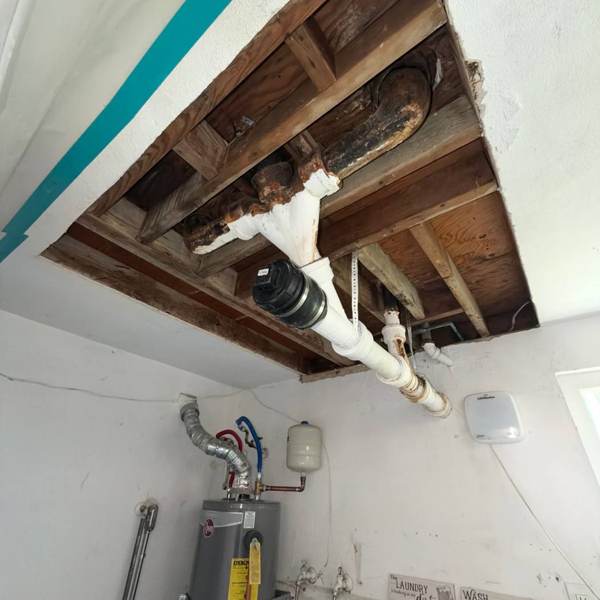 Ceiling opened at a leaking drain line